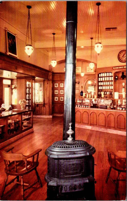 Vintage Postcard Pot Bellied Stove And Hanging Chandeliers UpJohn's Drugstore